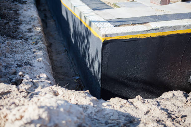 Professional Exterior Waterproofing technician working in Fowler, MI